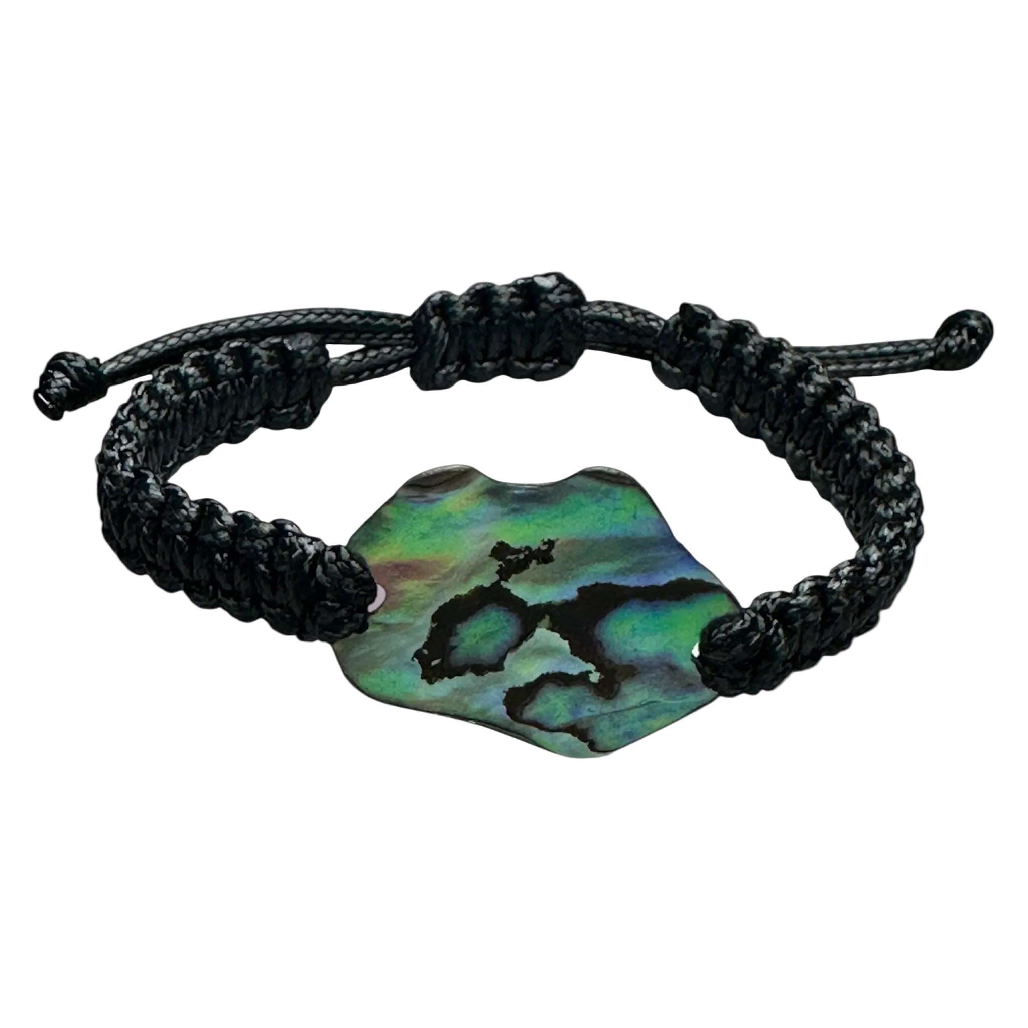 Close-up of adjustable black cord bracelet featuring an iridescent Paua shell from NZ.