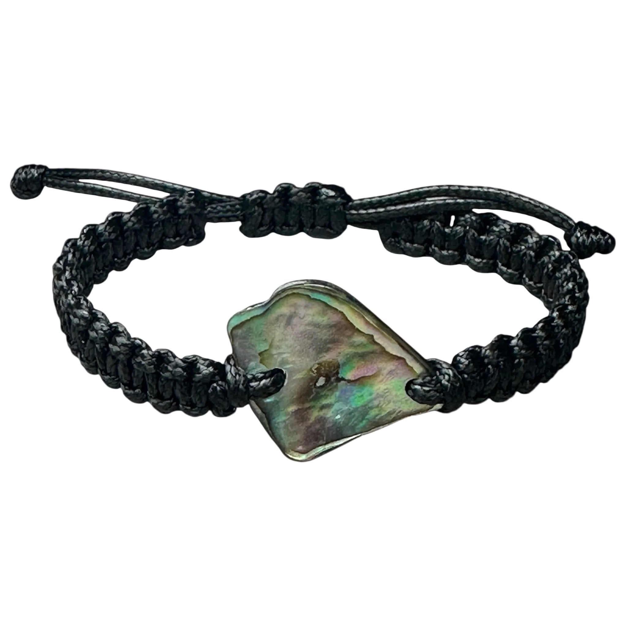 Black string bracelet showcasing a shimmering Paua shell, styled flat on a neutral surface.
