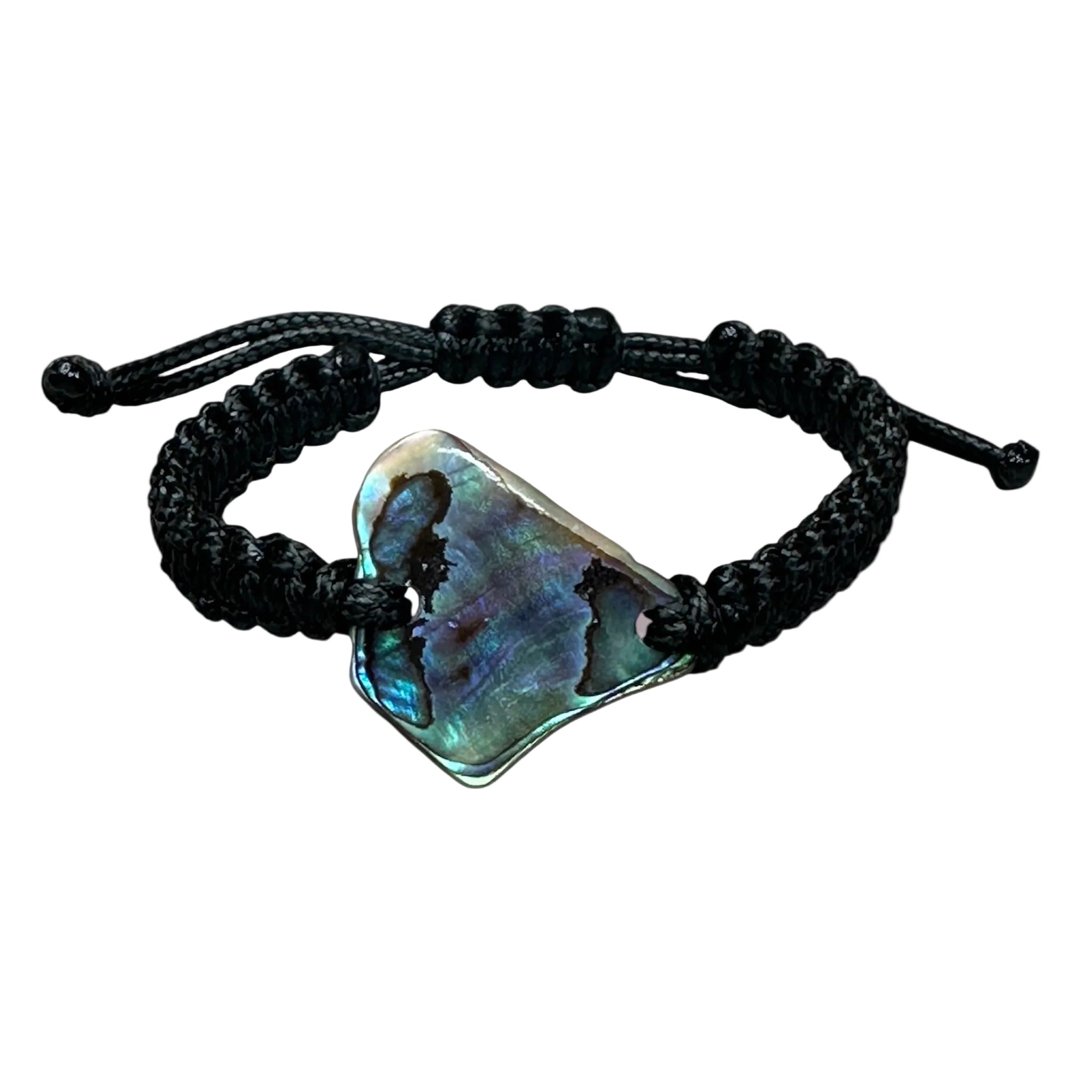 Handmade square knot bracelet with a central Paua shell, shown in natural light.